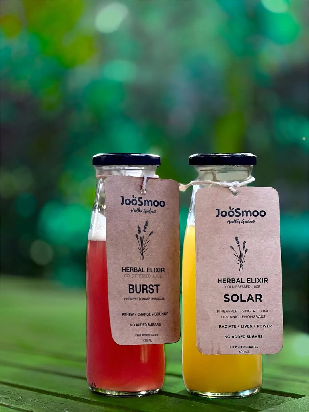 Two JooSmoo juice bottles outdoors