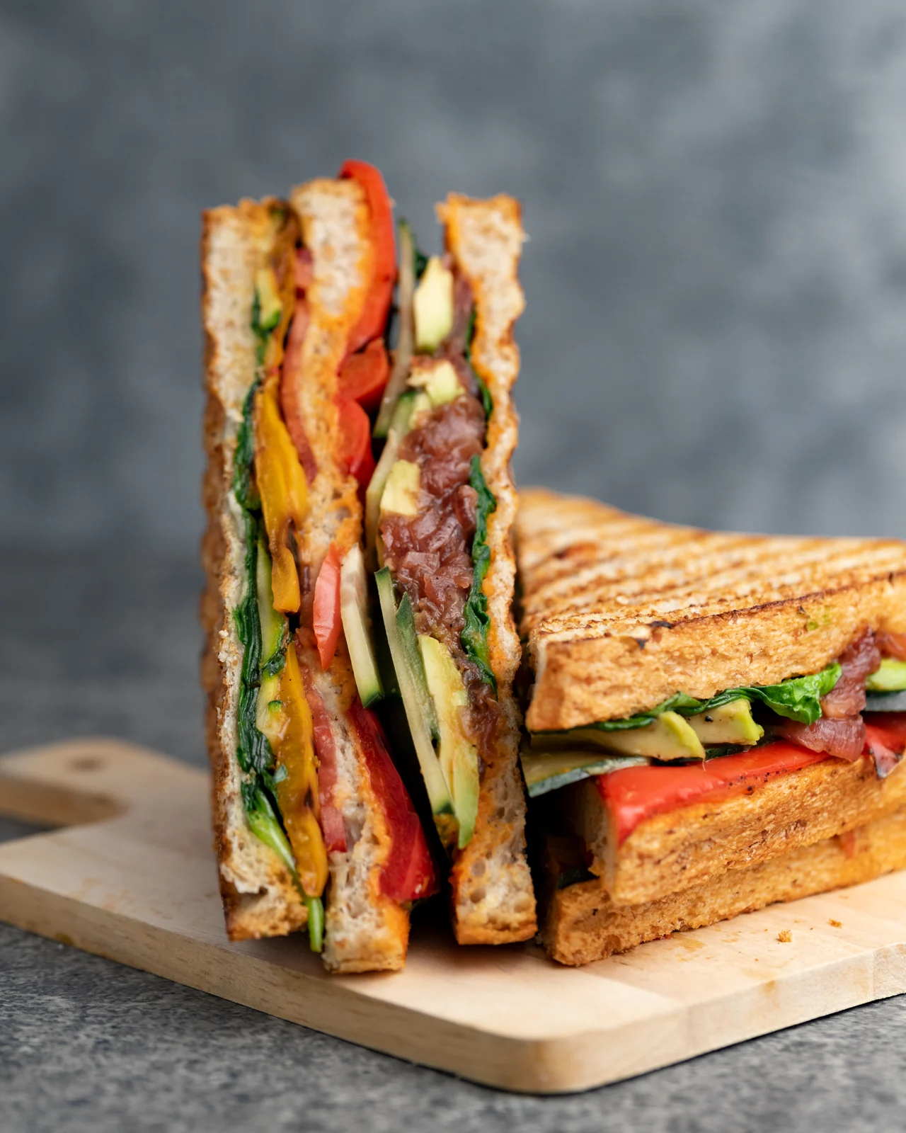 JooSmoo grilled sandwich stacked on a wooden board
